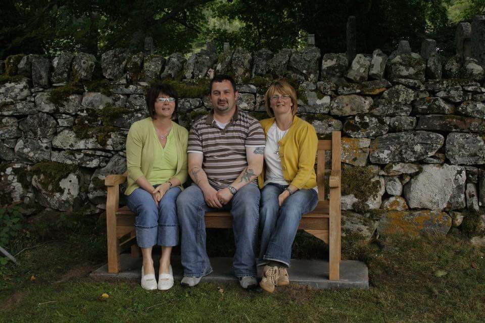 Photo of photos/Gregor & sisters on the seat at Strathconon cemetery